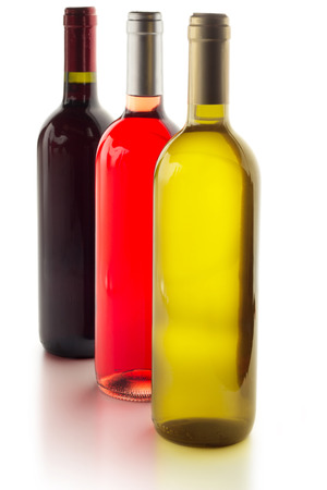 three wine bottles isolated on white backgroundの写真素材