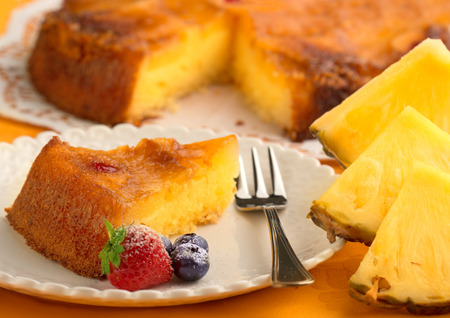 piece of pineapple cake and fresh pineappleの写真素材