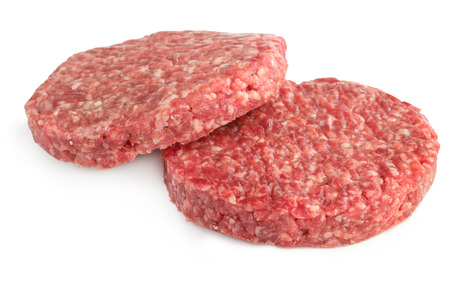 two hamburger patties isolated on white backgroundの写真素材
