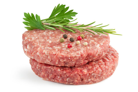 hamburger patties and aromatic herb isolated on white backgroundの写真素材