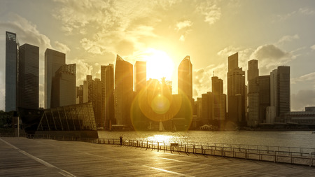 skyscrapers in backlight with flare at sunsetのeditorial素材