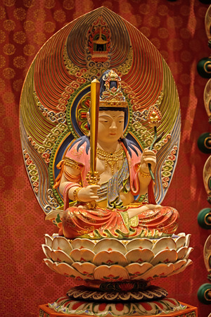 colorful statue of buddha inside the templeの写真素材