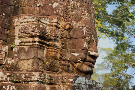 stone sculpture of buddha in bayon siteの写真素材