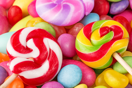 striped lollipops on multicolor confectioneryの写真素材