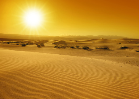 sunset over the sand dunes in the Death Valleyの写真素材