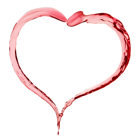 red liquid in shape of heart on white backgroundの写真素材