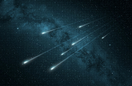 meteor shower in the starry night skyの写真素材