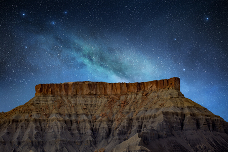 milky way in a starry night on rocky mountの写真素材
