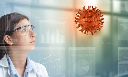 Female scientist analyzing a virus hologramの写真素材
