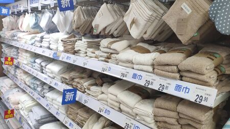 Shelf with bath towels in supermarket in Guangzhou Chinaのeditorial素材