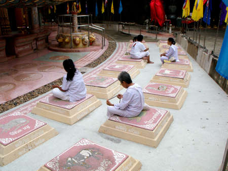 Wat Sam Phran Temple, Nakhon Pathom, Thailand, November 16, 2015: Nuns converse or meditate at Wat Sam Phran Templeのeditorial素材