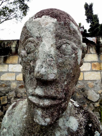 Pulau Samosir, Lake Toba, Sumatra, Indonesia, January 12, 2018: Close-up of an ancient sculpture of a king made of stone in a cemetery of Lake Toba, Pulau Samosir. Indonesiaのeditorial素材