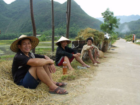 Mai Chau, Vietnam, June 20, 2016: Rice field workers during a break in the Mai Chau valley, Vietnamのeditorial素材