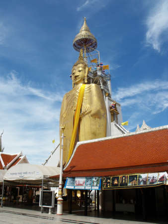 Bangkok, Thailand, September 9, 2015: A 32 meter tall Buddha stands tall over the buildings at Wat Intharawihan in Bangkok, Thailandのeditorial素材