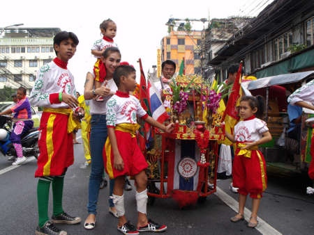 Bangkok, Thailand, November 14, 2015: Group of people dressed in the colors of their clan in a festival of the clans of the Chinese community of Bangkokのeditorial素材