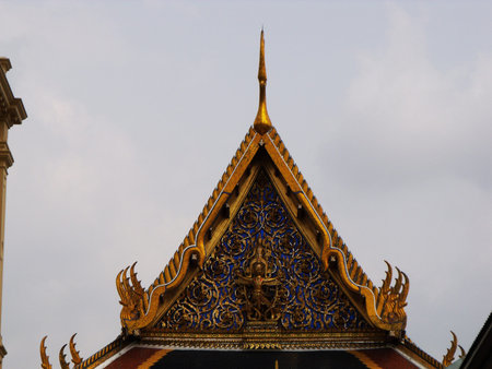 Bangkok, Thailand, January 25, 2013: Gold and blue decoration of one of the buildings of the Royal...