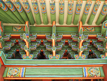 Seoul, South Korea, September 25, 2016: Detail of the colorful decoration on the ceiling of a wooden...