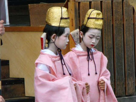 Kyoto, Japan, July 13, 2016: Two Japanese children dressed in traditional kimono and white makeup on their faces in a Kyoto templeのeditorial素材