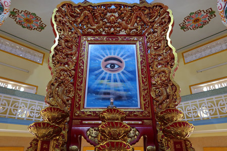 Hoi An, Vietnam, November 19, 2020: The richly decorated All-Seeing Eye in the main hall of worship...