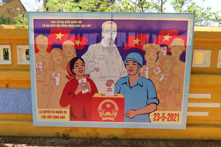 Hoi An, Vietnam, May 23, 2021: Election poster at the entrance of the Dinh Cam Pho Temple enabled to vote in the XV parliamentary elections in Hoi An, Vietnamのeditorial素材