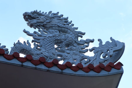 Hoi An, Vietnam, September 22, 2021: One of the dragons on the main entrance gate of Nam Ton Templeのeditorial素材