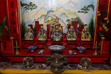 Hoi An, Vietnam, October 10, 2021: Small sculptures with deities on the altar of the prayer hall of the Hy Hoa temple in Hoi An, Vietnamのeditorial素材