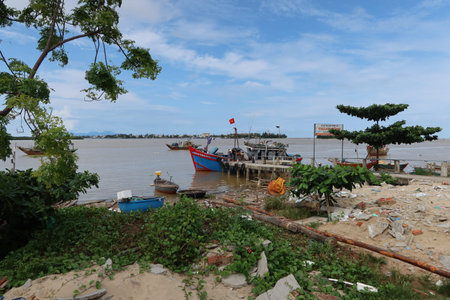 Hoi An, Vietnam, October 30, 2021: Fishing boat moored at a dock in the Duy Hai fishing port. Thu Bon river mouth. Hoi An, Vietnamのeditorial素材