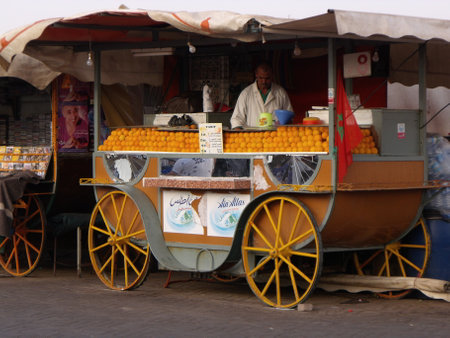 Marrakech, Morocco, August 12, 2012: Orange seller in Jemaa El Afna Square. Marrakech. Morocco.のeditorial素材