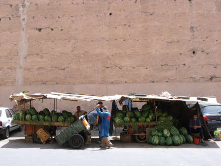 Marrakech, Morocco, August 13, 2012: Stall selling watermelons next to the wall of Marrakech. Moroccoのeditorial素材