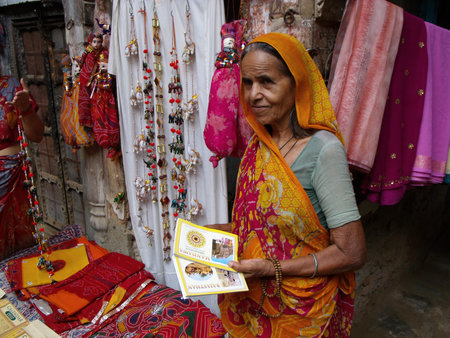 Mandawa, Rajasthan, India, August 11, 2011: A woman sells souvenirs to tourists in an old palace or haveli in Mandawa, Rajasthan, Indiaのeditorial素材