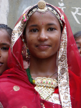 Rajasthan, India, August 15, 2011: A schoolgirl dressed in colorful clothes at the celebration of...