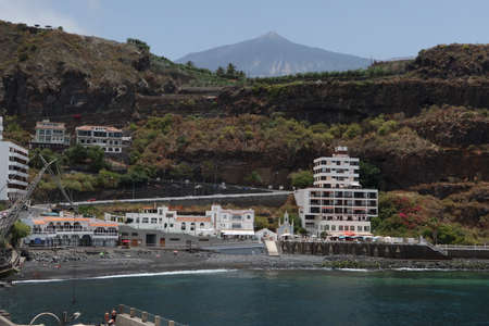 San Marcos beach, Icod de los Vinos, Tenerife, Spain, June 8, 2022: San Marcos beach with volcanic sand in the Atlantic Ocean with Teide volcano in the background, Icod de los Vinos, Tenerife, Spainのeditorial素材