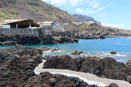 Garachico, Tenerife, Canary Islands, Spain, July 6, 2022: El Caleton natural pools next to the old fishing port of Garachico, Tenerife. Spainのeditorial素材