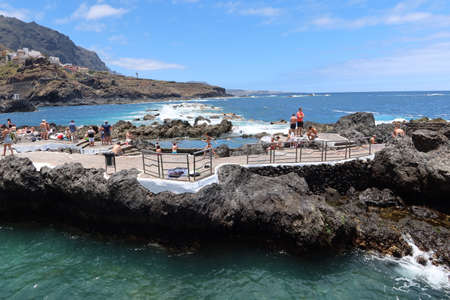 Garachico, Tenerife, Canary Islands, Spain, July 6, 2022: El Caleton natural pools in the Atlantic ocean, Garachico, Tenerife. Spainのeditorial素材