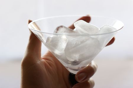 icy martini in left handの写真素材