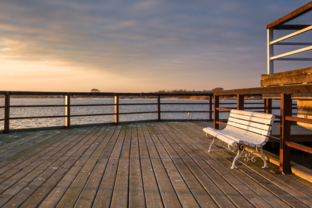 Wooden pier in Jastarnia village on Hel Peninsula at sunset time. Poland.の写真素材