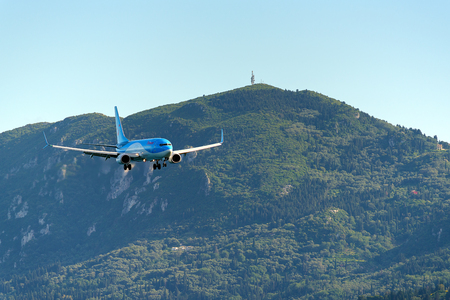 CORFU, GREECE - May 13, 2016: Aircraft Boeing 737-800 approaching Corfu International Airport. Corfu island, Greece.のeditorial素材