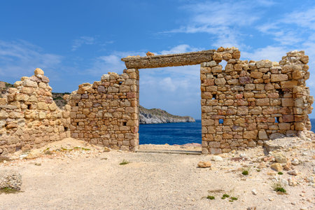 The ruins of an ancient building in the picturesque village of Firopotamos on Milos Island. Cyclades, Greece.の写真素材