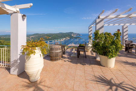 CORFU GREECE - May 10, 2016: Restaurant terrace with view of beautiful Bay of Palaiokastritsa. Corfu Island, Greece.のeditorial素材