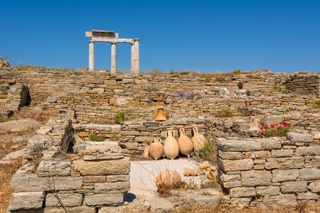 Ancient pots and the Temple of Apollo ruins in the Archeologic Site of Delos island, Cyclades, Greeceの写真素材