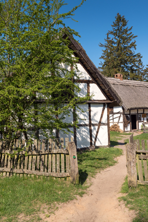 Old whitewashed house in ethnographic open-air museum in Kluki. Polandのeditorial素材