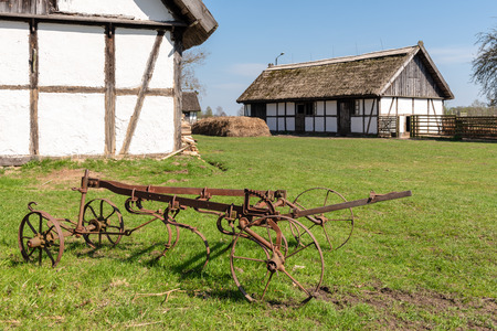 Old farm machinery in open-air museum in Kluki village. Polandのeditorial素材
