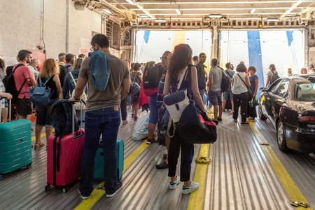 SERIFOS, GREECE - September 8, 2018: Interior of Speedrunner III ferry of Aegean Lines. Tourists are waiting for disembark.のeditorial素材