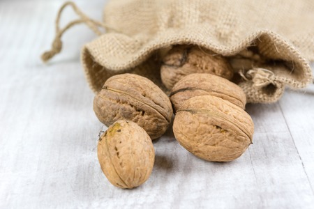 Fresh walnuts in a burlap bag. Garden harvest. Healthy food.の写真素材