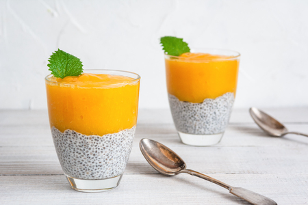 Chia seeds pudding with mango puree. Healthy breakfast. Sweet healthy dessert.の写真素材