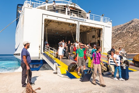 SIFNOS, GREECE - September 10, 2018: Tourists disembark from ferry ship in Sifnos island. Cycladesのeditorial素材
