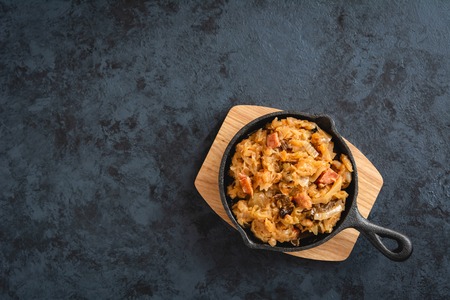 Bigos-traditional Polish dish of finely chopped sauerkraut and fresh cabbage with meat, mushrooms, and sausage. The dish is also traditional for Belarusian, Ukrainian and Lithuanian cuisine.の写真素材