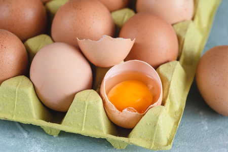 Group of fresh organic chicken eggs in carton box.の写真素材