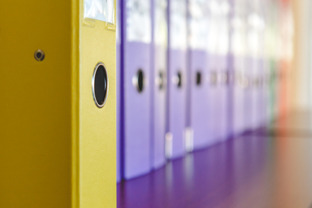 A row of binders for documents in the officeの写真素材