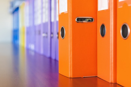 A row of binders for documents in the officeの写真素材